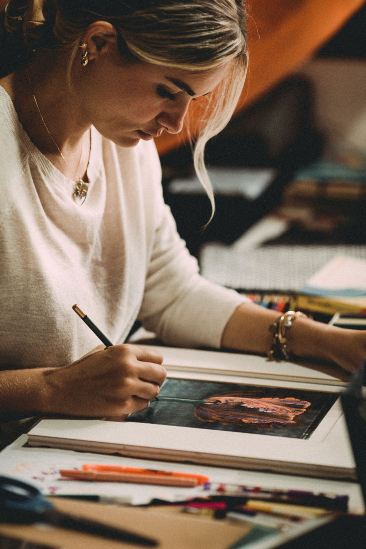 woman drawing a flower