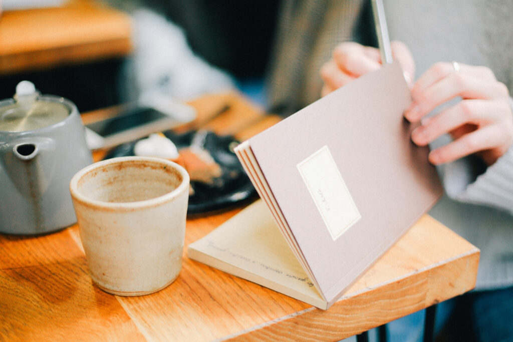 journaling with a mug